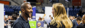 Recruiter talking to UF student in a career fair
