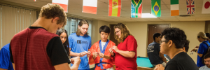 Multiple UF students doing origami