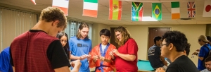 Students learn origami at a Japanese festival