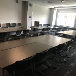 Picture of Exploration Room with tables and chairs arranged in classroom style