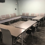 Picture of Conference Room with tables and chairs arranged in circle style