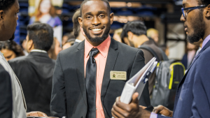 UF student in career showcase smiling at the camera