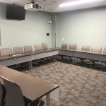 Picture of Conference Room with tables and chairs arranged in u-shape style