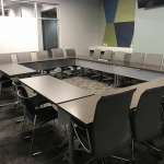 Picture of Conference Room with tables and chairs arranged in circle style