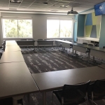 Picture of Exploration Room with tables and chairs arranged in circle style