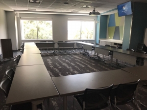 Picture of Exploration Room with tables and chairs arranged in circle style
