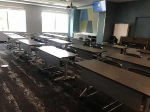 Picture of Exploration Room with tables and chairs arranged in classroom style