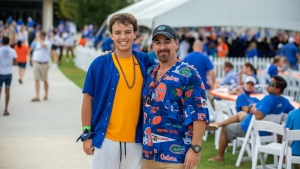 Picture of two family members posing at UF's Family Weekend