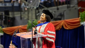 Woman looking into crowd at UF's convocation